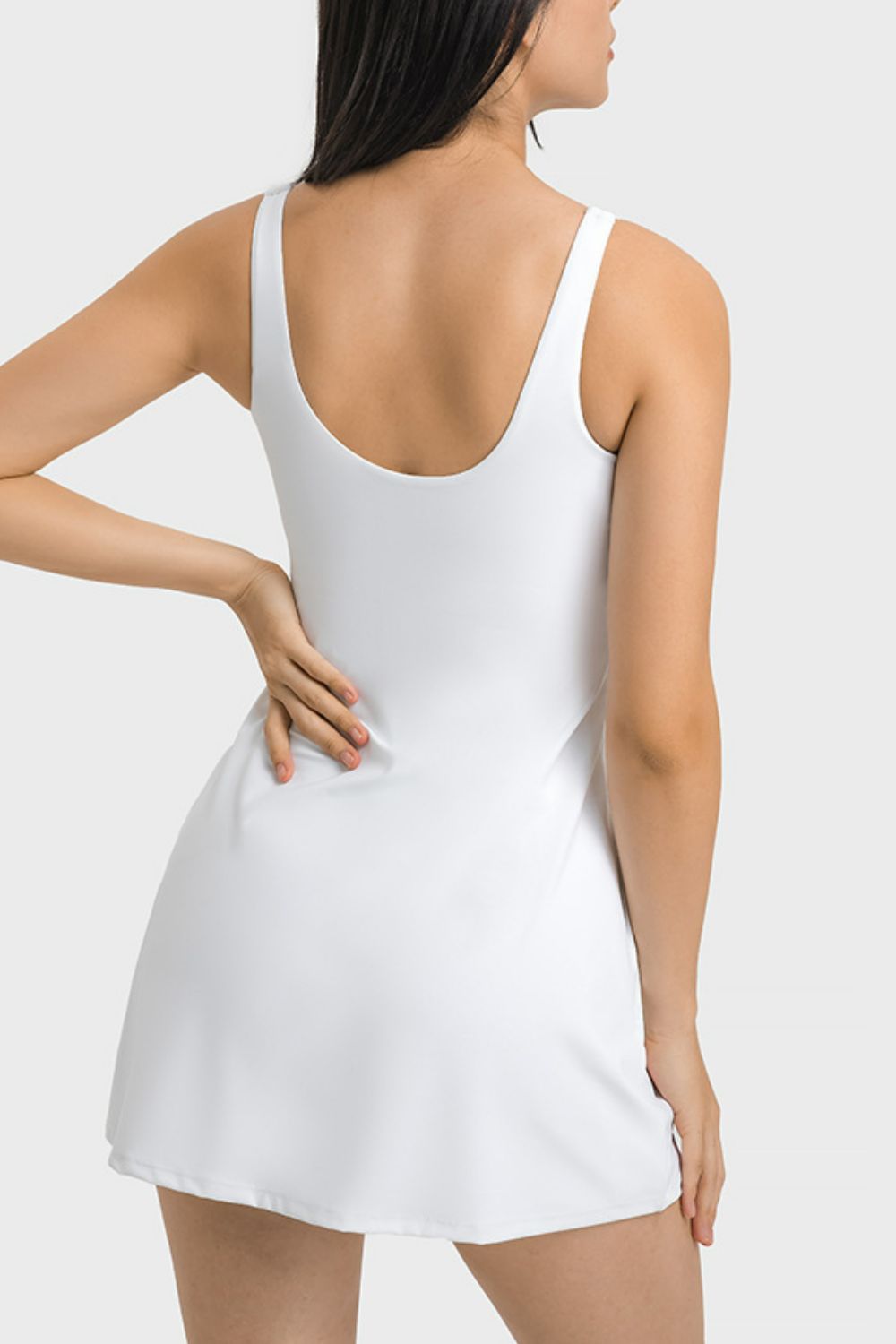 The Millennia Square Neck Sports Tank Dress combines performance and style with its full coverage, pocketed bottoms. Perfect for the gym or everyday wear, experience both comfort and fashion. Order now and elevate your athletic wardrobe!