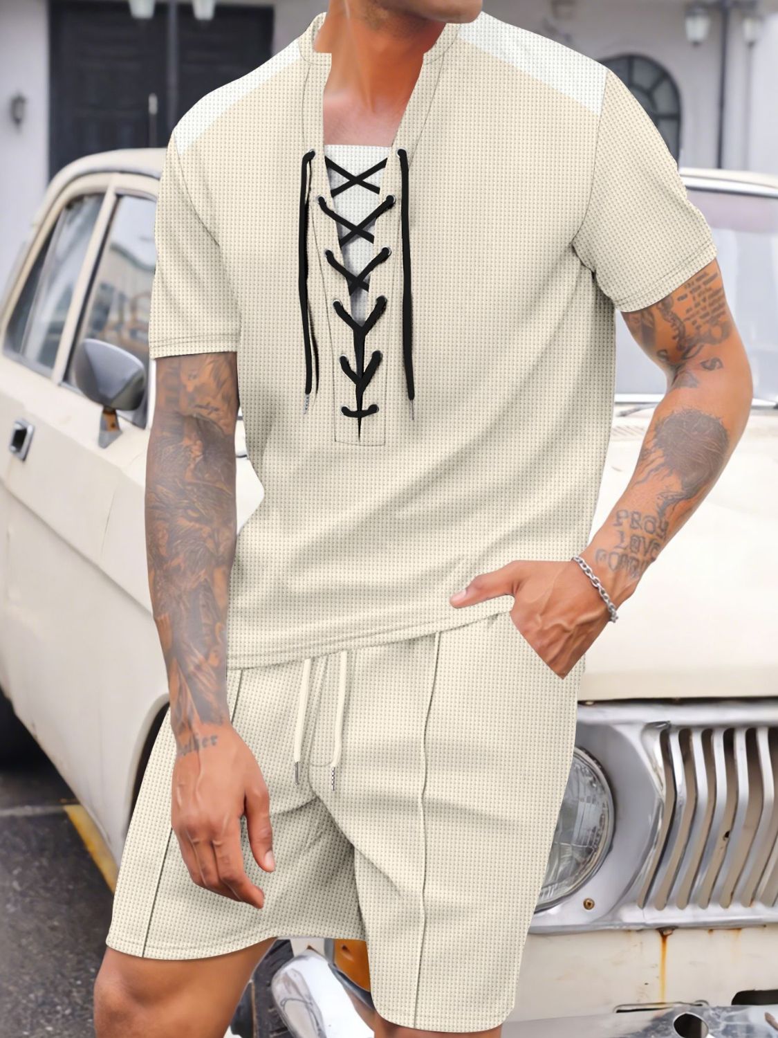 Experience comfort and style with our Men's Full Size Lace-Up Waffle Knit Top and Shorts Set! Made with soft and breathable waffle knit fabric, this set is designed to keep you cool and comfortable all day long. Plus, the lace-up detail adds a stylish touch that sets this set apart. Perfect for any occasion, in a full range of sizes!
