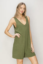 Stay stylish and comfortable in this V-Neck Sleeveless Romper made from a breathable 80% rayon and 20% linen blend. Its deep V-neck and relaxed bodice offer a flattering fit, while the breezy shorts keep you cool. Equipped with practical pockets, this romper combines function and fashion seamlessly. Pair it with sandals and a crossbody bag for an effortlessly chic, timeless look perfect for any casual outing.