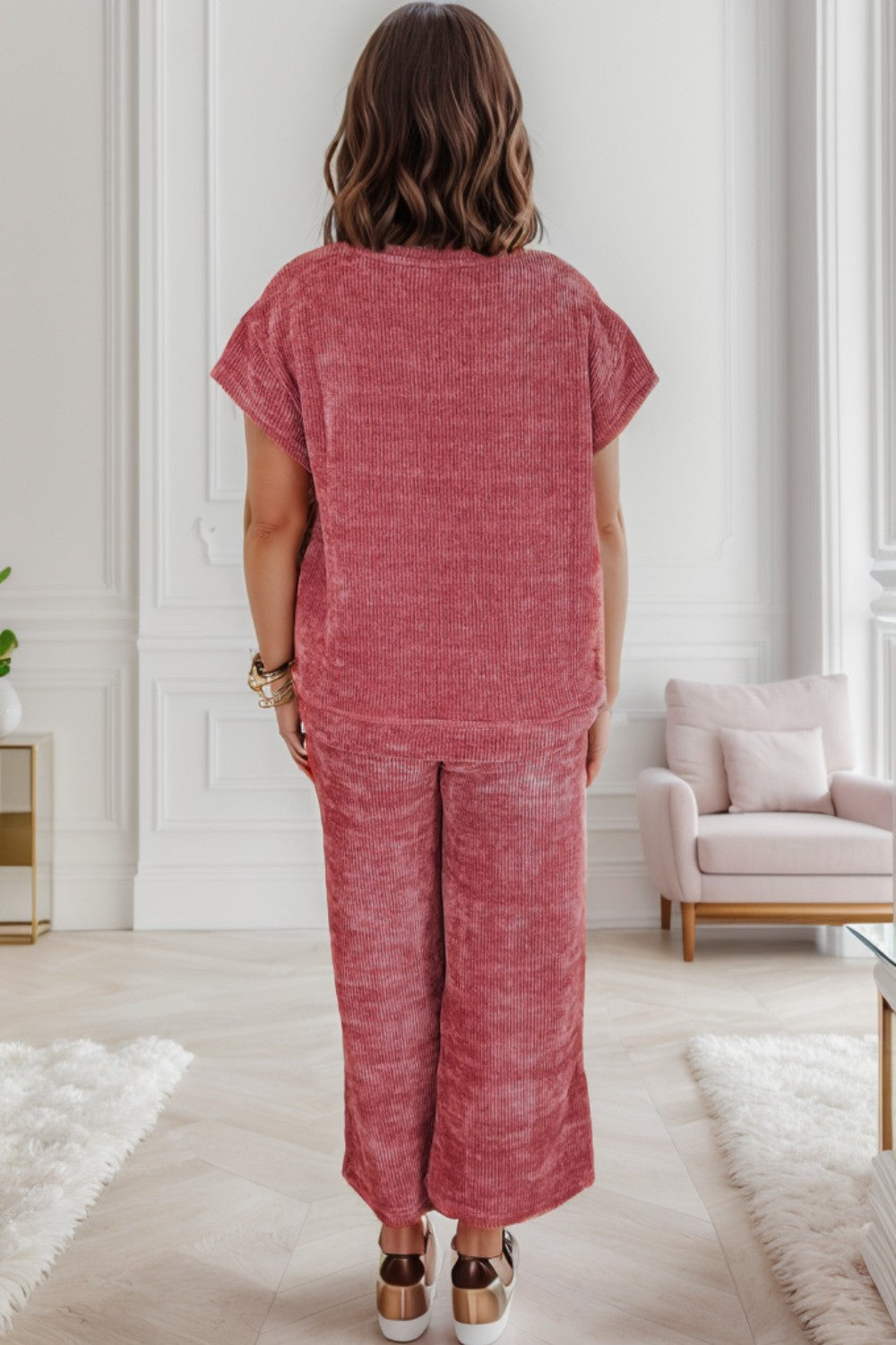 Polyester. A matching top and pants set with a round neckline and short sleeves. Breathable and comfortable for everyday wear, this two-piece combination works well on its own or paired with other items.