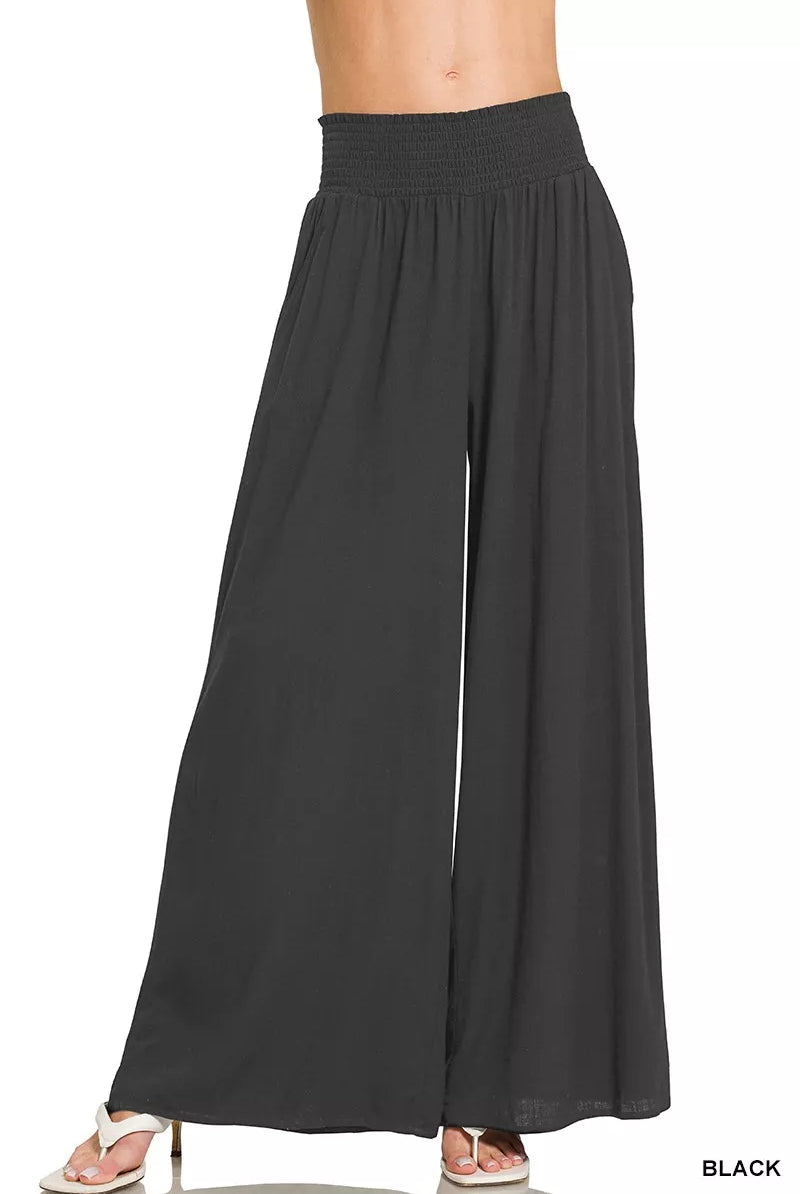 These wide-leg lounge pants balance relaxation with refined style. The smocked waistband provides gentle, adaptive support for all-day comfort, while the flowing silhouette offers freedom of movement without excess bulk. Constructed from soft, breathable material, they're equally suited to quiet evenings at home or casual daytime wear. A versatile wardrobe staple that prioritizes both ease and understated sophistication.