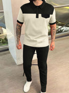 Polo top with pocket Men's Waffle-Knit Contrast Top and Pants Set from Cruisin Essentials! This stylish set features a green and black polo top with a convenient pocket, paired with burgundy, dark green, beige, and black pants. Available in sizes small to 3XL. Elevate your comfort in style today!