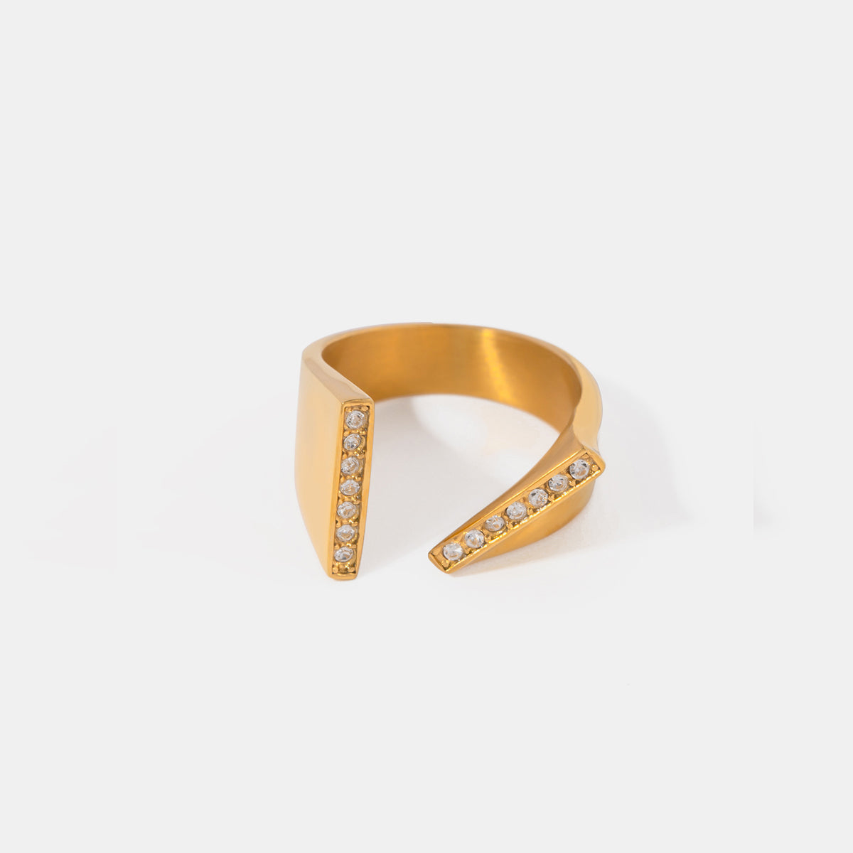 Looking for a way to elevate your style? Look no further than our stainless steel asymmetrical open ring! Crafted from durable stainless steel, this unique ring not only adds a touch of modern elegance to any outfit, but it also makes a statement and helps you stand out from the crowd. Plus, with an adjustable design and 18K gold-plated material, it's sure to catch everyone's eye. Worried about maintenance? No need to sweat it - just avoid wearing during exercise to avoid any potential deterioration or corr