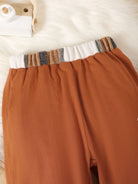 Upgrade your little one's wardrobe with Momma's Boy top and pants set. The stylish color block design and easy-to-use button up closure make it perfect for any event. Plus, the machine washable fabric makes it a practical choice for busy moms. Elevate their style while keeping things low maintenance!