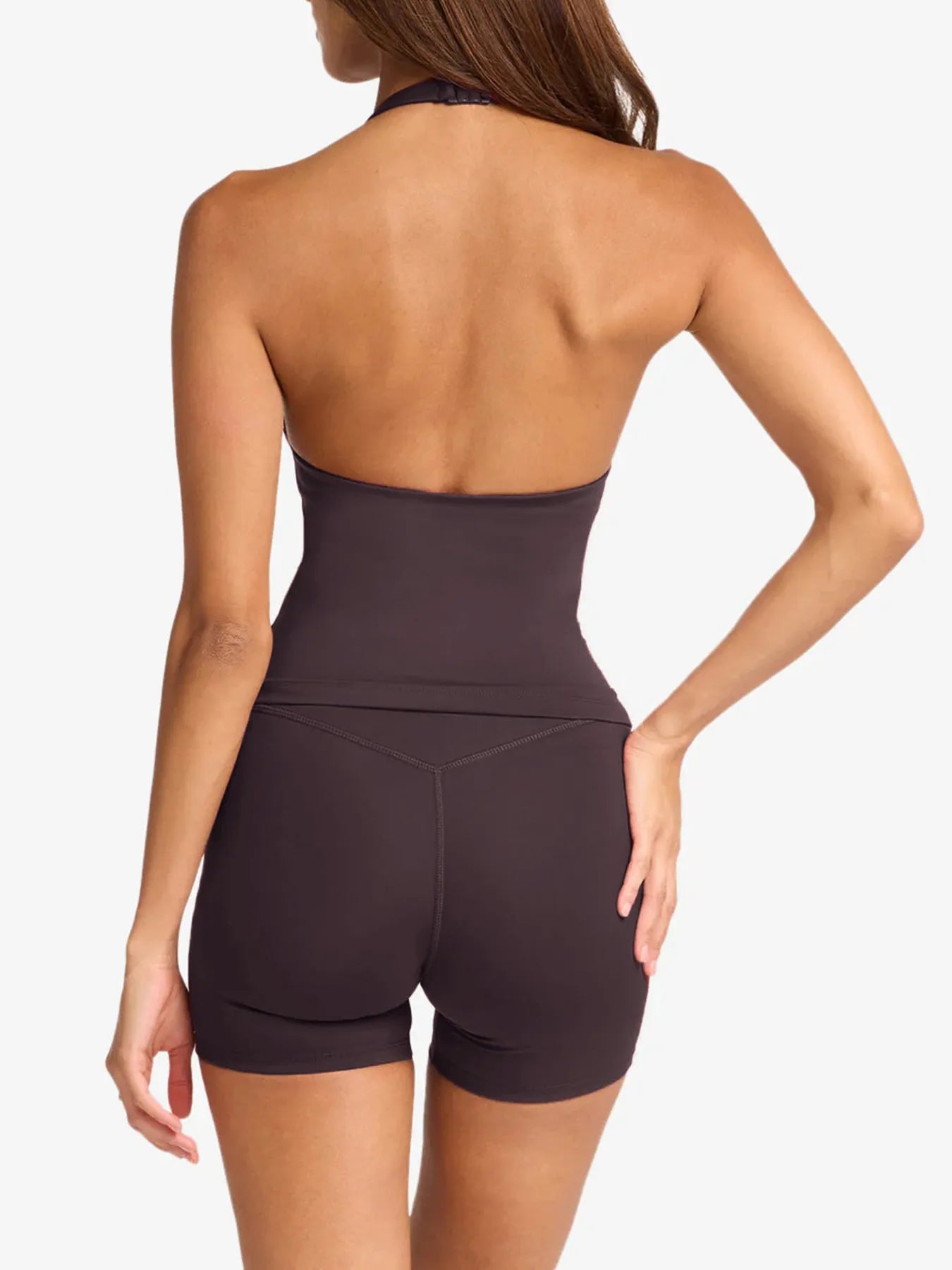 This Halter Neck Cami and Shorts Active Set combines minimalist design with high-performance functionality. The halter neck cami offers secure support and an elegant neckline, while the coordinating shorts provide unrestricted movement and breathability. Made from moisture-wicking, quick-dry fabric, this set keeps you comfortable during intense workouts or casual athleisure days. Its tailored fit enhances your silhouette, making it a versatile choice for both active sessions and relaxed wear.