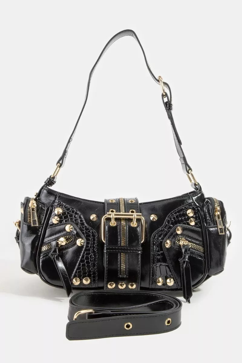 A detailed close-up view of the Stella bag, showcasing the beautiful texture of the genuine leather and the precise, high-shine finish of the hardware studs.