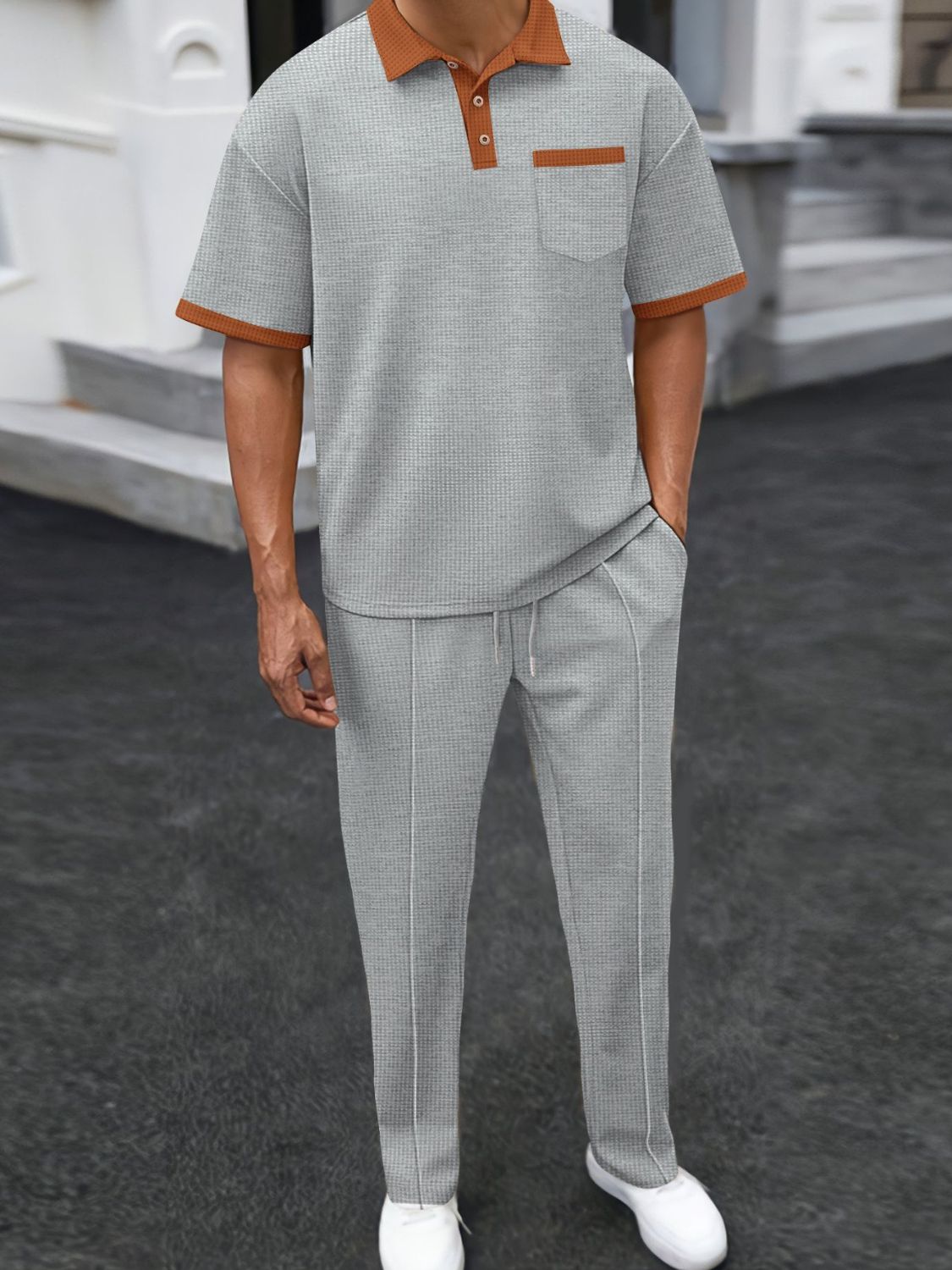 Elevate your style with our Men's Waffle-Knit Contrast Polo and Pants Set. Featuring a trendy accent color trim, our set is offered in a variety of classic colors and Plus Size options. Perfect for any occasion, this set is effortlessly stylish and comfortable.