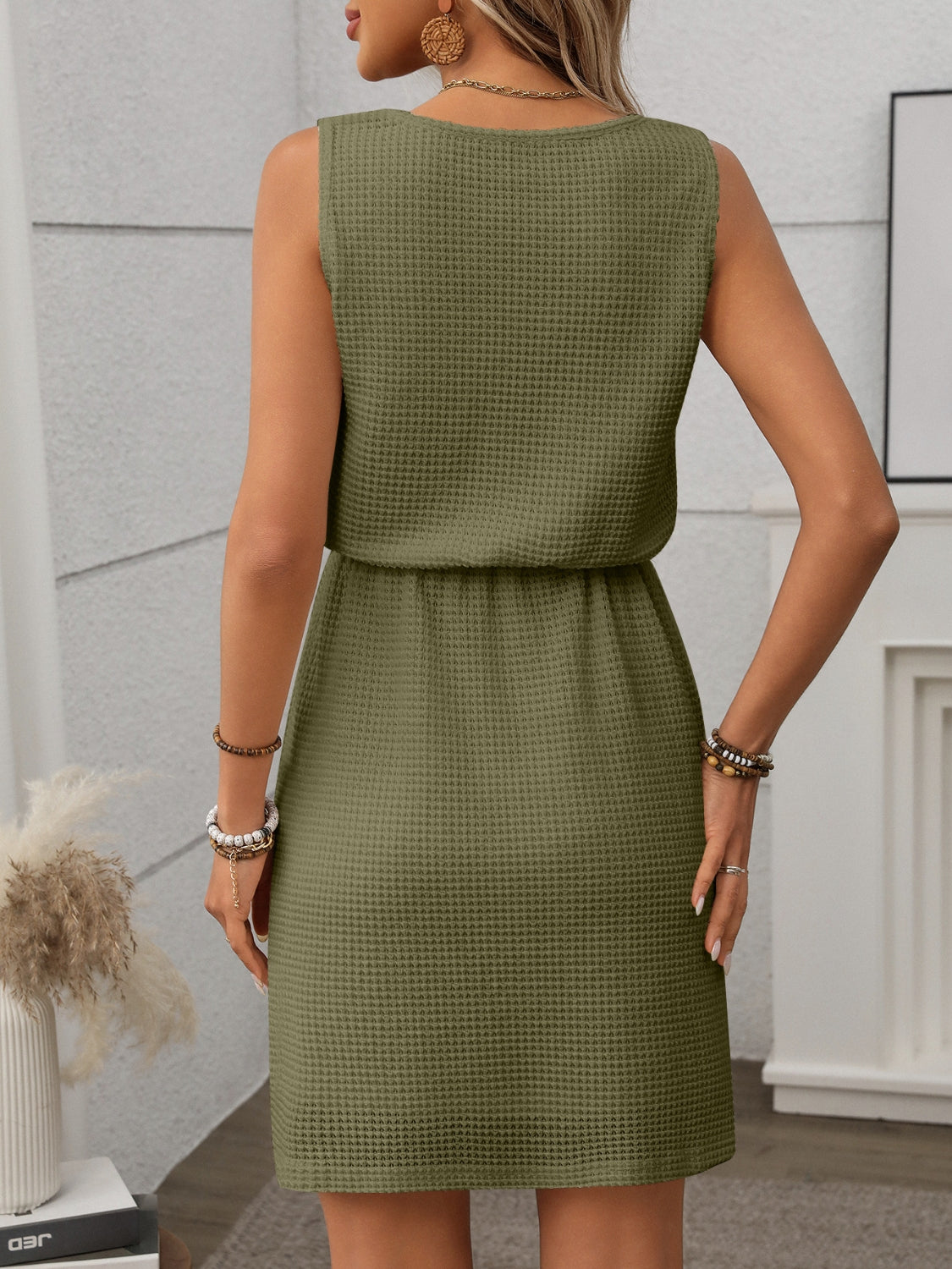 Elevate your summer wardrobe with our stylish Tank Dress. Crafted with a waffle-knit design, this sleeveless mini dress offers both comfort and style. The drawstring waist adds a flattering silhouette, making it perfect for any occasion. Upgrade your fashion game with our Tank Dress now!