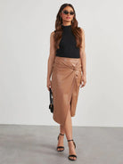 Looking for a sophisticated and eye-catching addition to your wardrobe? Look no further than our Twist Detail High Waist Skirt! Featuring a flattering high waist design and a unique twist detail, this skirt is perfect for making a statement and exuding confidence. Elevate your style with this versatile and must-have piece.