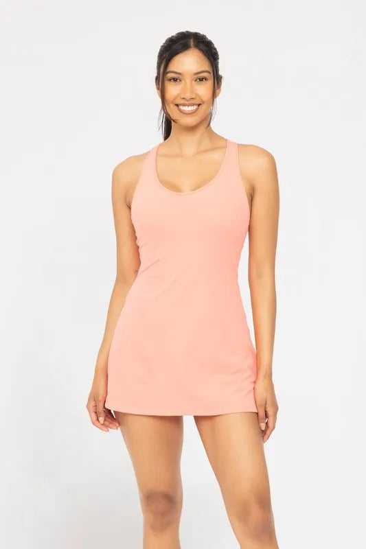 Woman wearing a pink dress against a white background