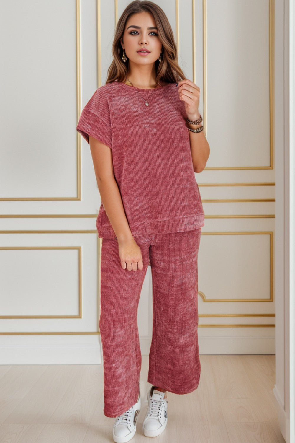 A coordinated round neck top and pants set that combines comfort with polished style. Perfect for warm weather wear and versatile enough for various occasions.