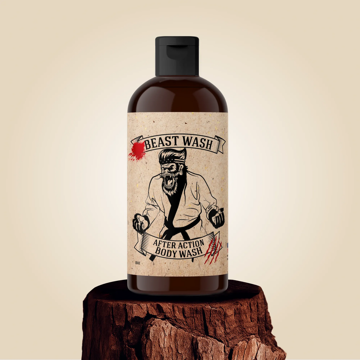 After Action Body Wash amber bottle with a Beast Wash illustrated label, standing on a wood pedestal.