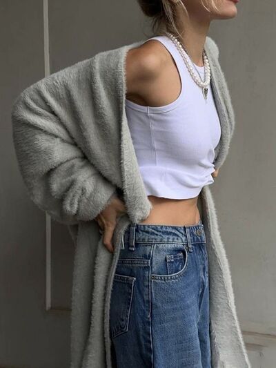 Stay cozy and daring with our Fuzzy Long Cardigan by Cruisin Essentials. Embrace the thrill of adventure while making a bold statement in this versatile piece. Experience ultimate comfort and style in this must-have addition to your wardrobe.