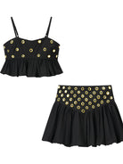 Unleash your bold side with the Eyelet Cami and Bubble Skirt Set. This striking combination pairs a subtly sheer eyelet cami with a dramatic bubble skirt, creating a fearless look that captivates at every turn. Designed for those who embrace daring fashion, this set delivers both attitude and allure in one unforgettable package.