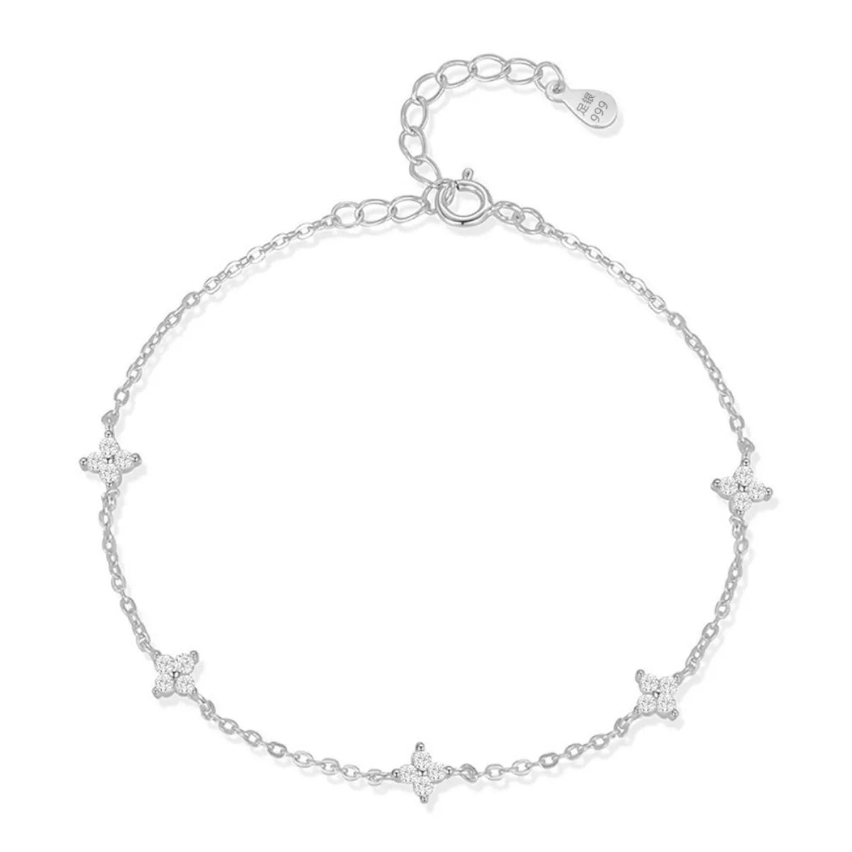 Silver bracelet with star-shaped charms on a white background