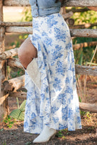 The Split Asymmetrical Ruffled Printed Skirt is the ultimate upgrade for your wardrobe. With a unique asymmetrical design, playful ruffles, and eye-catching prints, this must-have piece will make you stand out from the crowd. Add a touch of elegance to any outfit and make a statement wherever you go. Get your Cruisin Essentials.