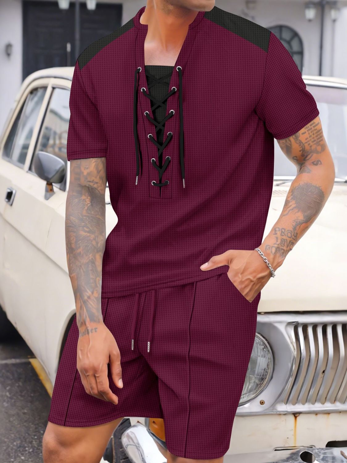 It's like a brandy wine essential. Cruise in style with our Men's Full Size Lace-Up Waffle Knit Top and Shorts Set Plus Size. The unique lace-up design adds a touch of personality while the waffle knit fabric ensures ultimate comfort. Perfect for lounging or running errands, this set is a must-have for any stylish man.