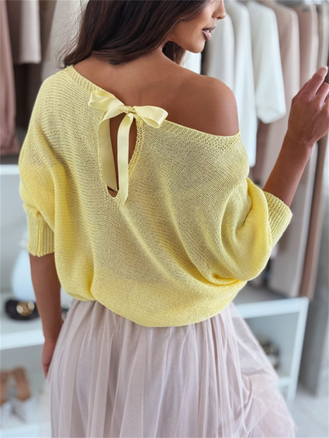 Discover effortless style with the Bow Back Boat Neck Batwing Sleeve Sweater. Featuring a graceful boat neckline and flowing batwing sleeves, this sweater offers both comfort and a chic silhouette. The delicate bow detail at the back adds a subtle, feminine touch, making it an ideal choice for dressing up or down with ease.