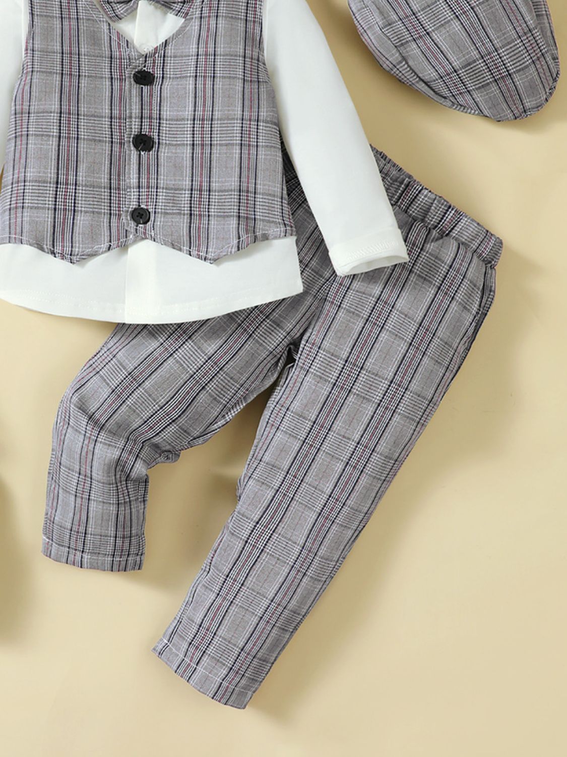 Get your little one ready for any occasion with our Plaid 4-Piece Set! This stylish set includes a cozy hat, long sleeve shirt, plaid vest, and pants to keep them warm and fashionable. Create endless outfits and turn heads with this versatile and must-have set!
