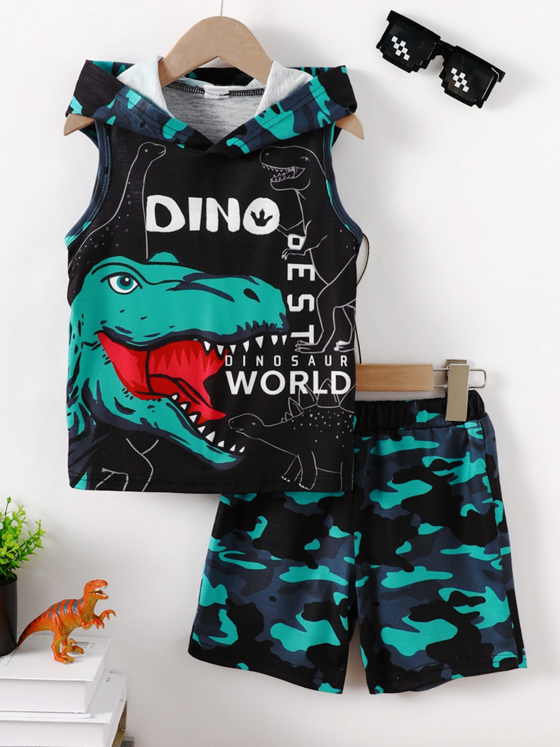 Unleash your child's imagination with our Children's Dinosaur Hooded Top and Pants Set! Made with soft and cozy material, this set features an adorable dinosaur design on the hooded top and matching pants. Keep your little one warm and stylish while they embark on prehistoric adventures.