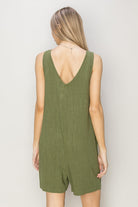 This V-Neck Sleeveless Romper combines comfort and style with its breathable 80% rayon and 20% linen fabric. Featuring a deep V-neck and relaxed bodice, it flatters every figure while the breezy shorts keep you cool. Equipped with handy pockets, it offers practicality without compromising on fashion. Pair it with sandals and a crossbody bag for an effortlessly chic and timeless look perfect for any casual outing.