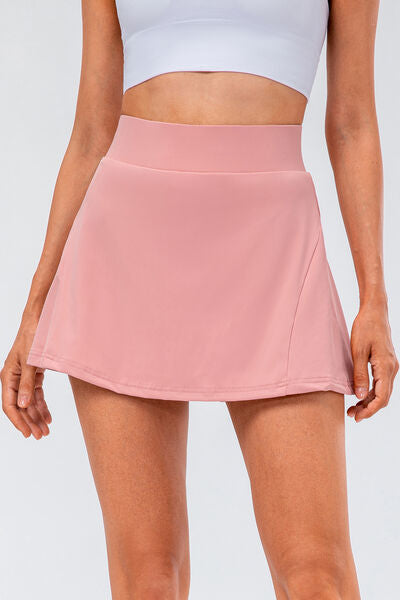 Elevate your athletic wardrobe with the High Waisted Pleated Active Skirt. Designed for style and performance, this skort features tummy control and a pocket for convenience. Perfect for yoga and tennis, this is a must-have for active women. Get yours now for a great deal!
