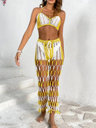 Woman wearing a yellow and white crochet cover-up on a white background