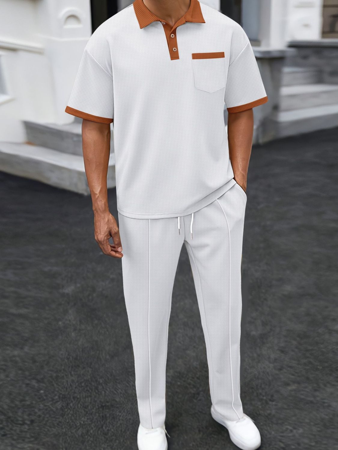 Unleash your style with our Men's Waffle-Knit Contrast Polo and Pants Set! Featuring a trendy accent color, this set offers both comfort and style in a variety of colors. Plus, its waffle-knit fabric adds a touch of texture for a unique look. 