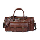Brown leather duffel bag with gold buckles on a white background