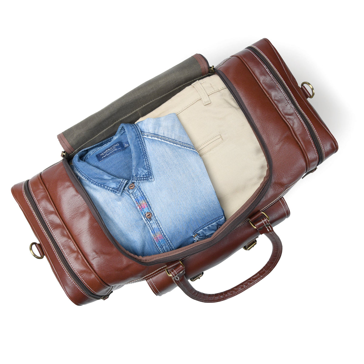 Brown leather duffel bag with clothes inside on a white background