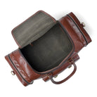 Brown leather duffel bag with open top on a white background