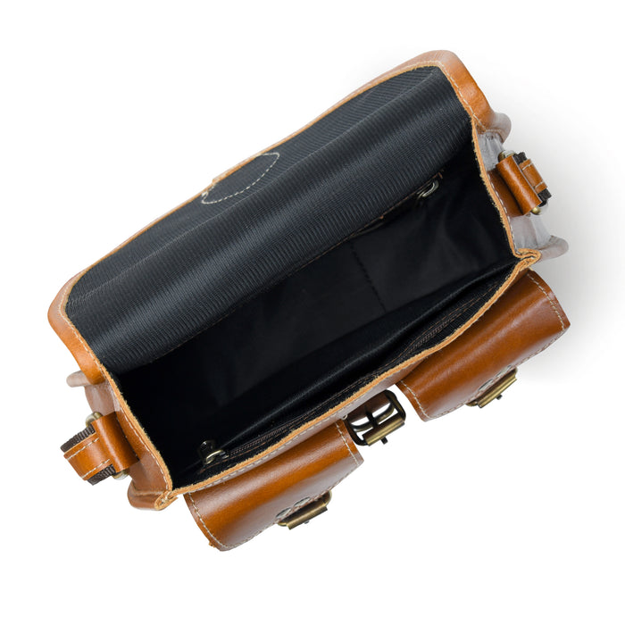 Brown leather bag with black interior on a white background