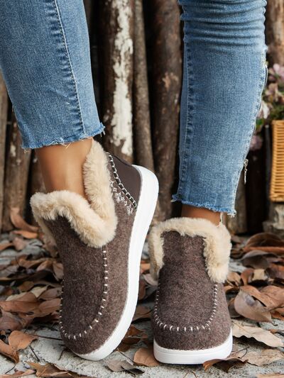 Get cozy and stylish with our Furry Suede Round Toe Flat Sneakers. The soft and furry exterior offers comfort and warmth, making them perfect for any occasion. Elevate your look and make a statement with these sneakers.