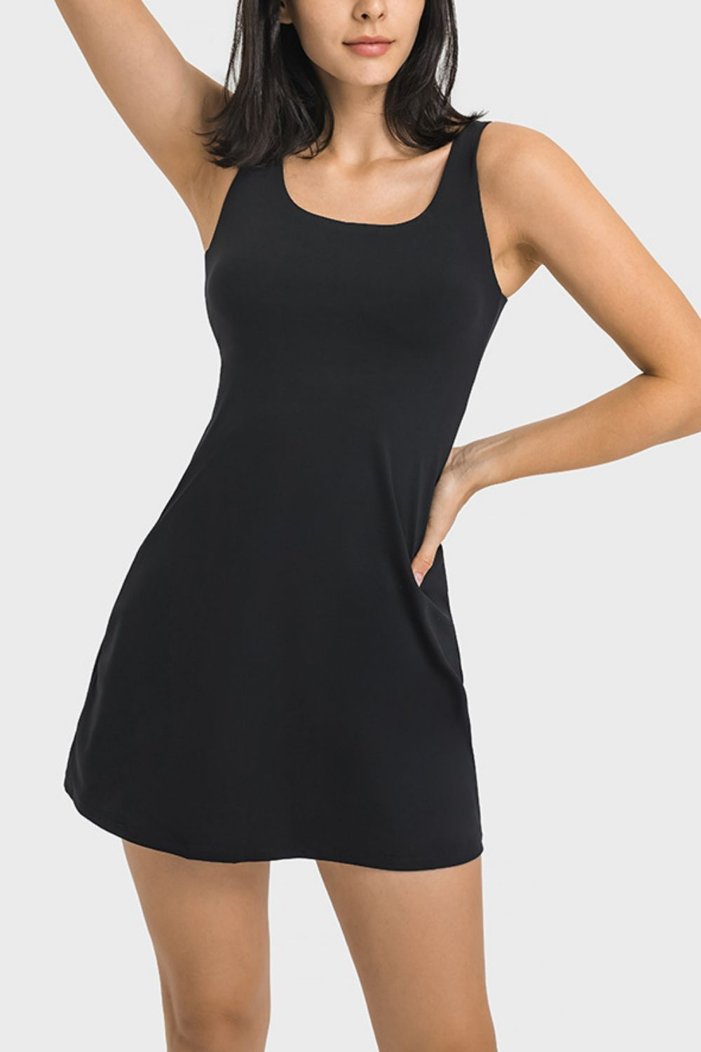 Take your workouts to a whole new level with our Black Millennia Square Neck Sports Tank Dress! Designed with full coverage and hidden pocket bottoms, it's the perfect blend of function and fashion. Whether you're at the gym or running errands, our dress will keep you comfortable and stylish. Don't wait, order now and elevate your workout wardrobe!