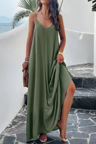 A woman wearing a matcha green backless maxi cami dress with pockets, standing near a tropical setting.