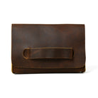 Brown leather clutch bag on a white background
