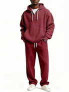 Men's casual two-piece waffle knit hoodie and pants set in rust orange color, oversized plus size lounge outfit.