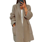 Camel knitted cardigan worn by a person on a white background