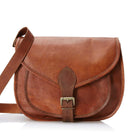Brown leather satchel bag on a white background
