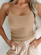 The Scoop Neck Cami is a comfortable, simple top with a flattering scoop neckline. It can be worn alone or layered, making it a versatile and practical wardrobe staple.