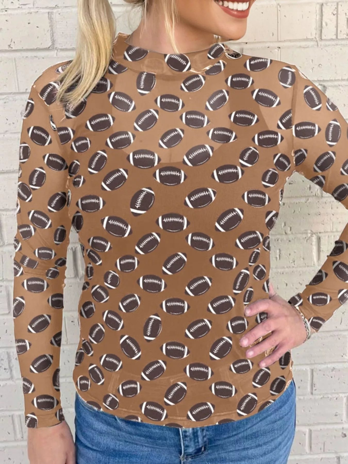 Designed for optimal breathability, the Mesh Sheer Long Sleeve Top features lightweight, sheer fabric that ensures ventilation while maintaining a sleek silhouette. Its long sleeves add versatility, making it ideal for layering or stylish alone. Combining comfort with a modern, sports-inspired aesthetic, this top delivers a confident, polished look perfect for game day.