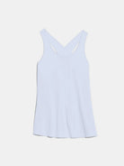Front view of a model styling the luxury light blue sleeveless athletic tank top