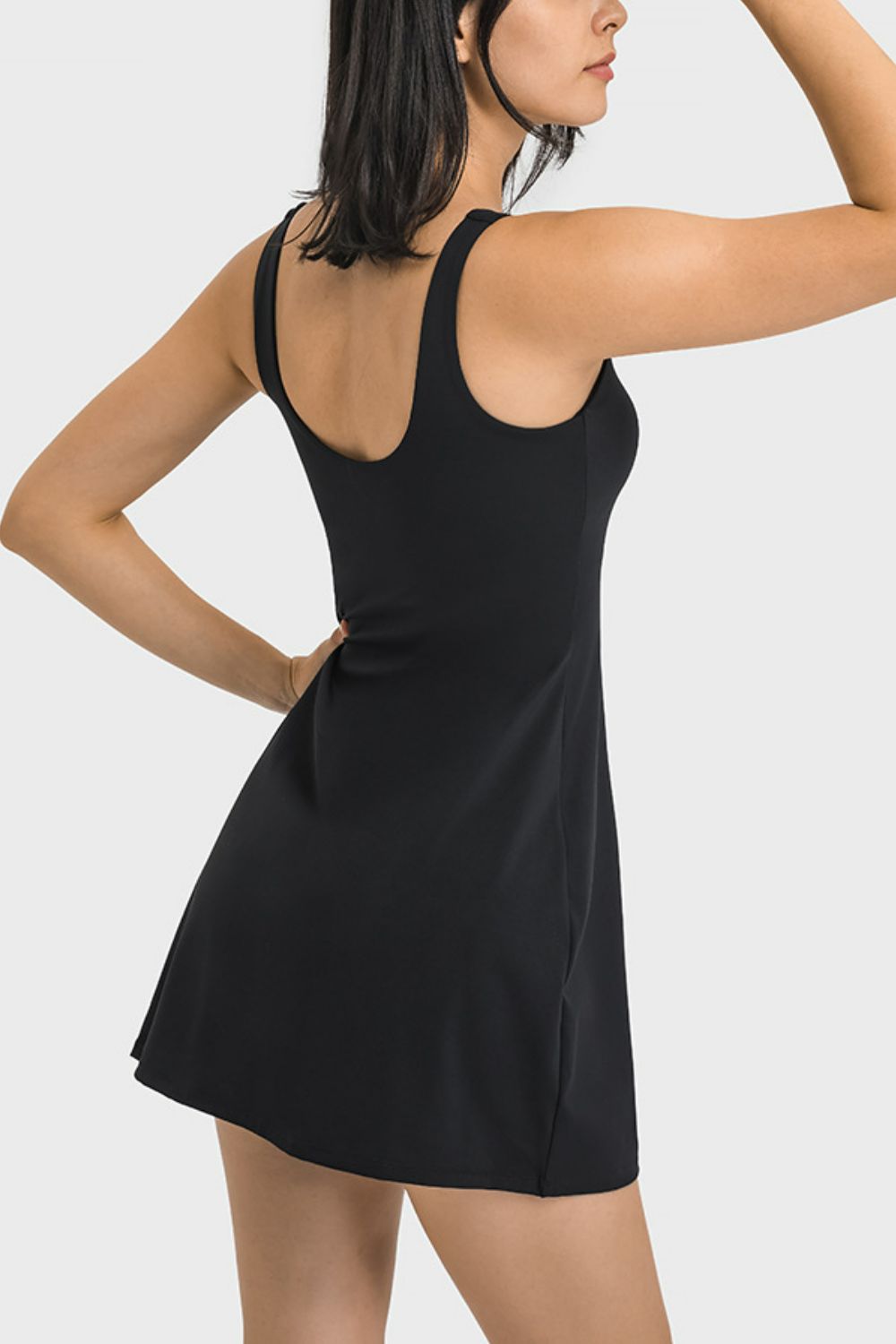 Upgrade your athletic wardrobe with our Millennia Square Neck Sports Tank Dress. Choose Black, White or Sage.  Perfect for the gym or everyday wear, it offers full coverage and discreet pocket bottoms for added convenience. Order now for the perfect blend of performance and style!