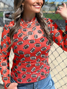 This Game Day Mesh Sheer Long Sleeve Top combines breathable mesh fabric with a streamlined design to keep you comfortable and stylish. Its lightweight, sheer material enhances airflow, while the long sleeves offer versatility for layering or wearing solo. Perfect for fans who want a modern, sporty look with expert craftsmanship and attention to detail.