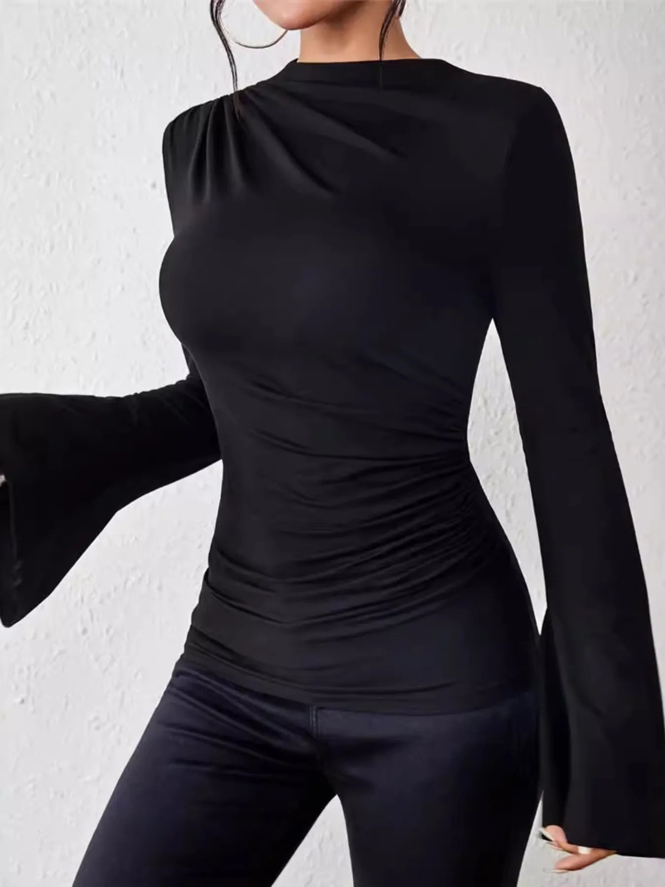 Add a little flair to your wardrobe with this Bell Sleeve Fitted T-Shirt! The playful bell sleeves bring fun volume, while the snug fit and chic mock neck keep things sleek and stylish. Perfect for twirling through your day or adding a quirky twist to your casual looks!