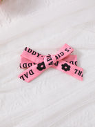 This coordinated three-piece outfit includes a letter-adorned headband, a ruffle sleeve top, and matching shorts. Made from a comfortable and stretchy blend of 95% polyester and 5% elastane, it provides an ideal fit and style for children.