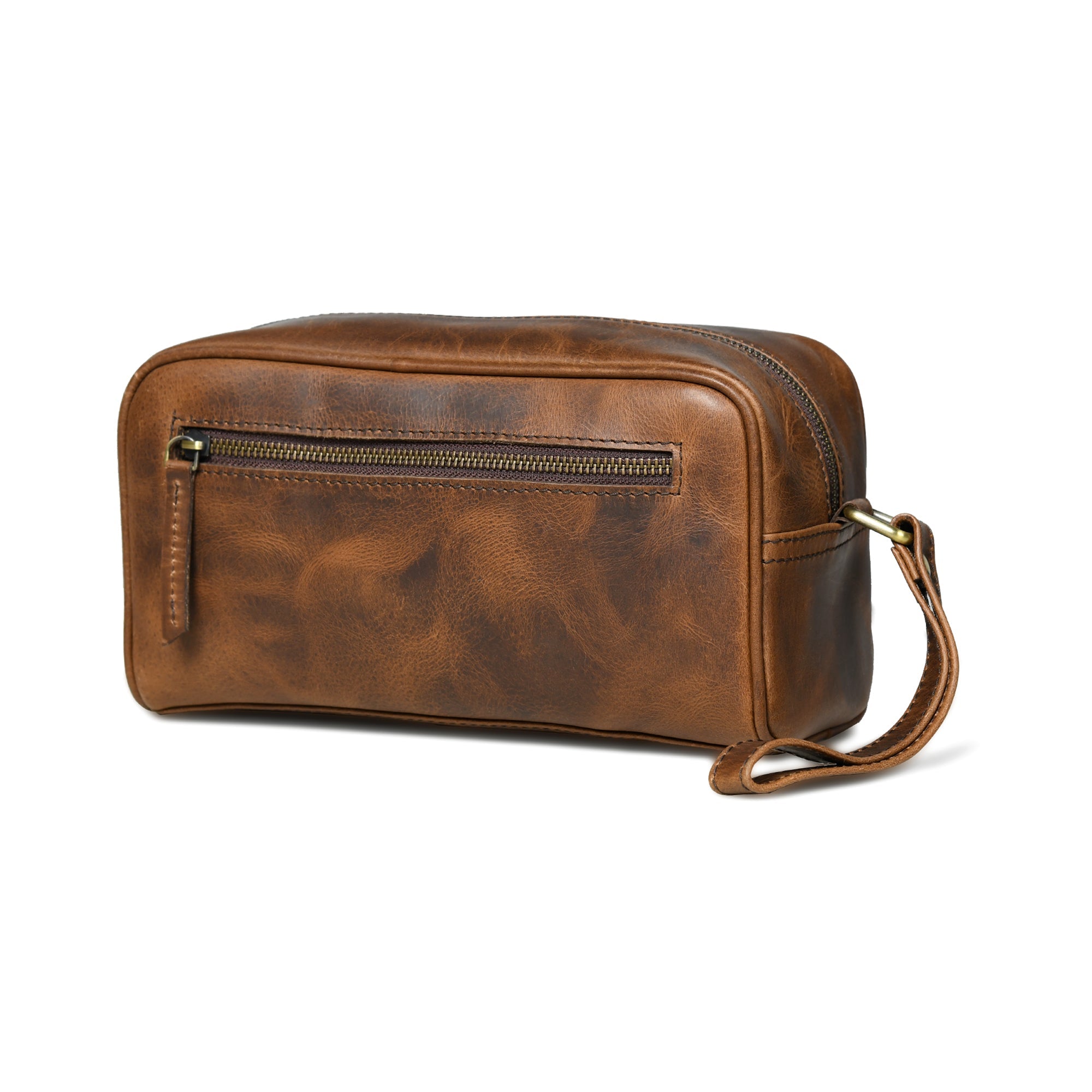Brown leather toiletry bag with a strap on a white background