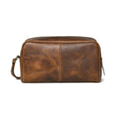 Brown buffalo leather toiletry bag on a white background