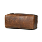 Brown buffalo leather toiletry bag on a white background