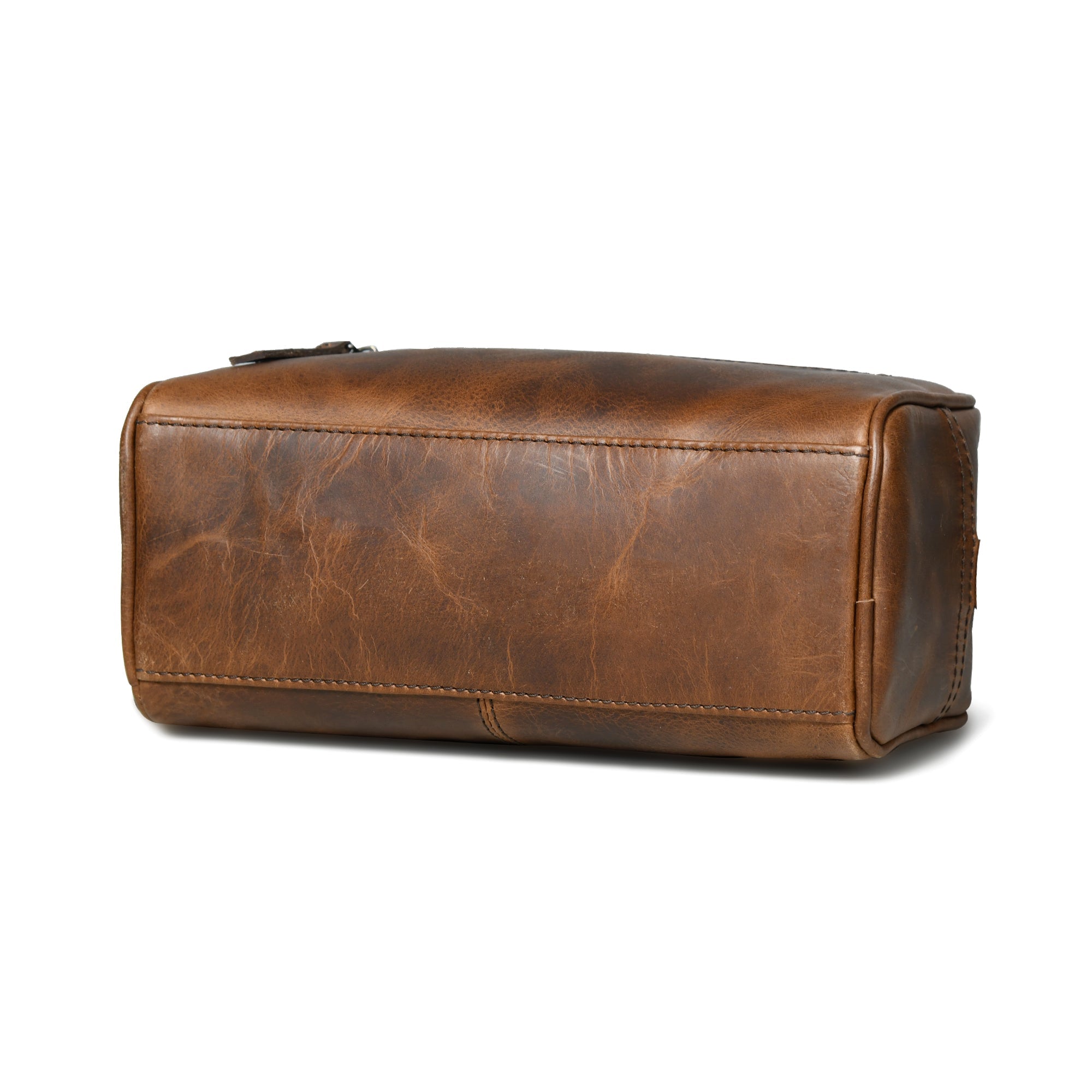 Brown buffalo leather toiletry bag on a white background